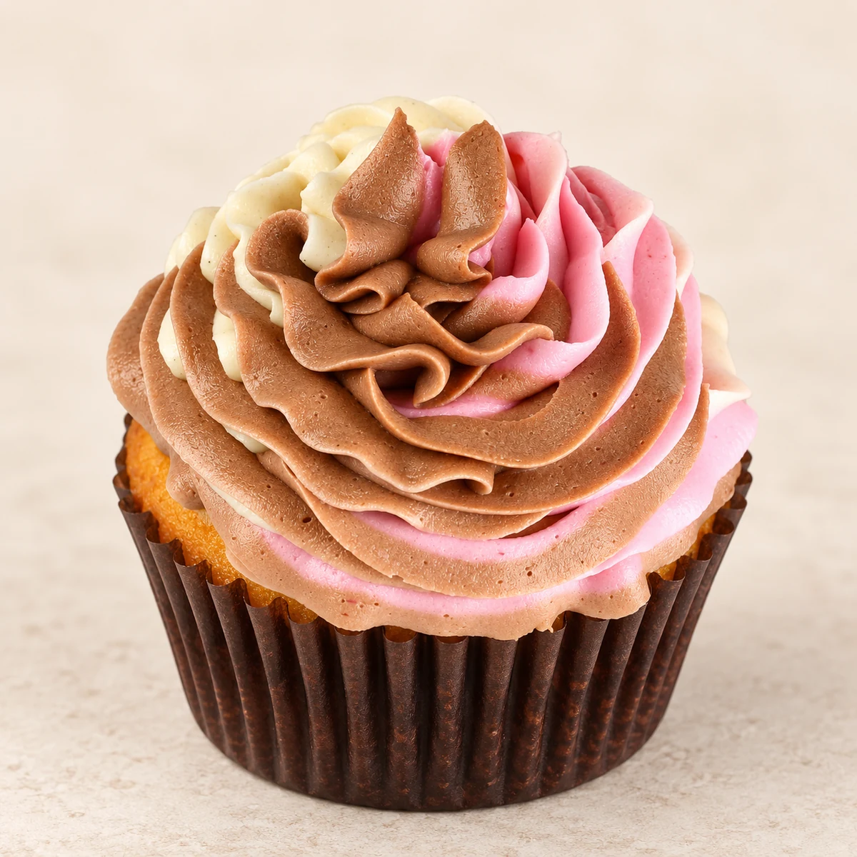 Neapolitan cupcake with chocolate, strawberry, and vanilla buttercream by Kakey Mae