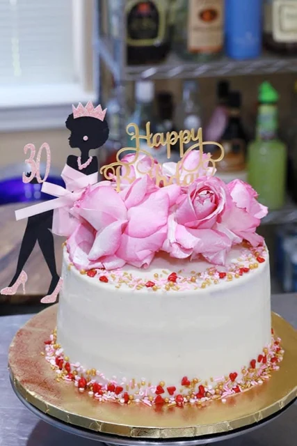 Pink roses birthday cake by Kakey Mae. Pink roses, a birthday silhouette, and gold details on a white celebration cake.