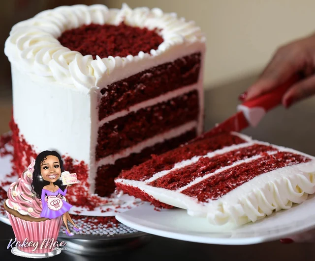 Red velvet by the slice by Kakey Mae. A sliced red velvet cake showing red layers, white frosting, and a piped finish.