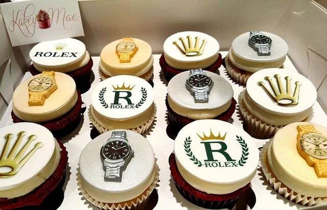 Watch-inspired cupcake set by Kakey Mae. Watch faces and gold-and-silver details on personalized round toppers.