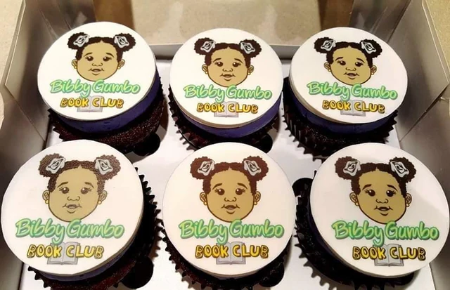 Personalized logo cupcakes by Kakey Mae. Custom printed round toppers featuring an illustrated logo and celebratory message.