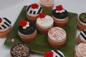 Roses & party messages by Kakey Mae. Red rose-shaped decorations, striped toppers, and personalized notes in a coordinated set.
